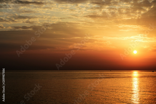 Beautiful sunrise over the sea on the coast of Sicily. Cefalu, Italy