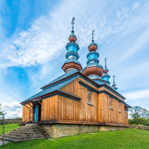 View at the Wooden church of Virgin Mary in Komancza - Poland photo