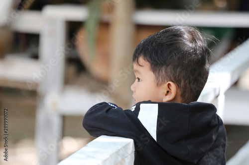Focus on Action of Asian boy is Staring at something.