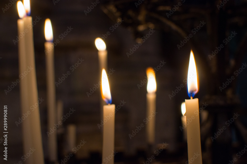 Close up of candles burning inside the Saint Bavo Cathedral (or Sint-Baafs Cathedral) in Ghent, Belgium, Europe. Spirituality. Close up of candles burning inside the Saint Bavo Cathedral (or Sint-Baafs Cathedral) in Ghent, Belgium, Europe. Spirituality.