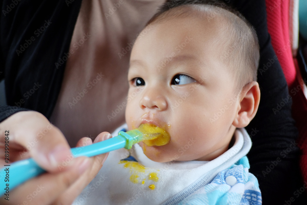 Asian boy with strabismus and eating food. Asian boy with strabismus and eating food.