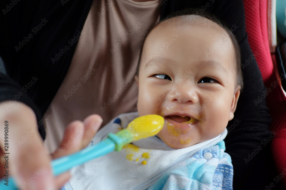 Asian boy with strabismus and eating food. Asian boy with strabismus and eating food.