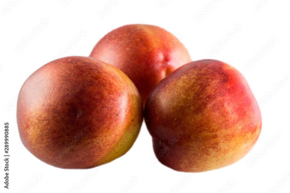three peaches isolated on a white background three peaches isolated on a white background