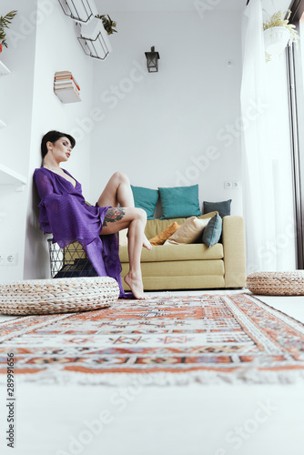 female with short haircut poses in Tbilisi loft