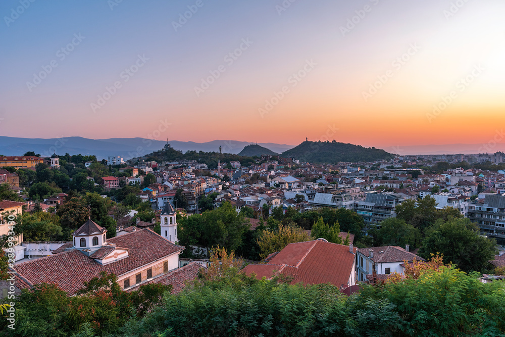 Summer sunset cityscape from Nebet tepe Hill in Plovdiv city, Bulgaria. Panoramic aerial view. Ancient Plovdiv is UNESCO's World Heritage and the oldest European city
