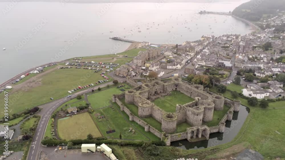Beaumaris castle, Anglesey, Wales. Aerial view above coastal town ...