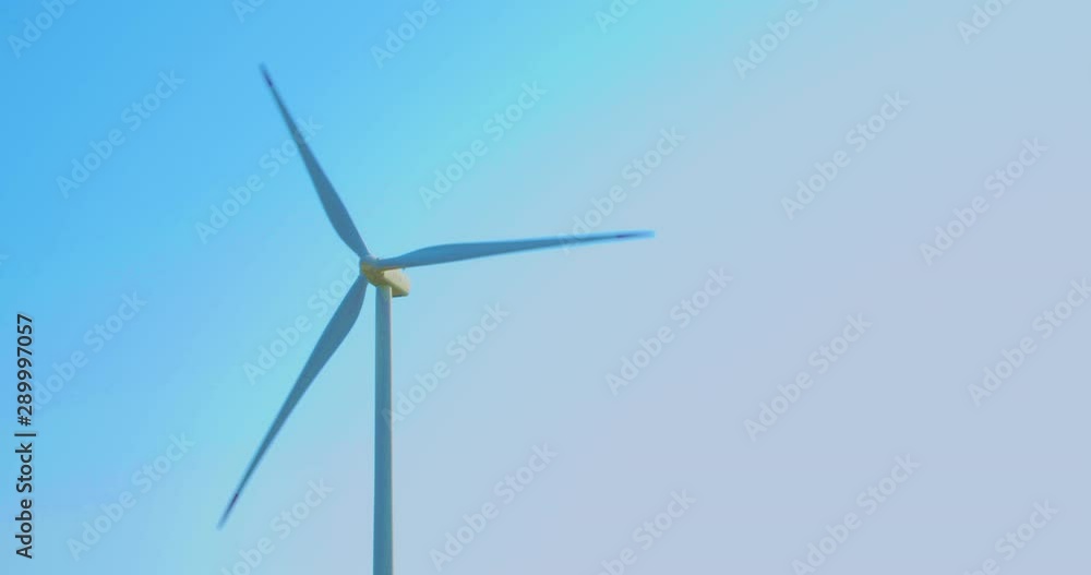Single wind generator spinning in a windy weather Single wind generator spinning in a windy weather