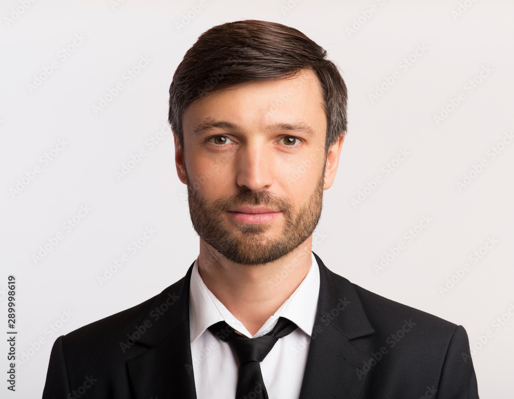 Businessman In Suit Looking At Camera Over White Background, Isolated ...