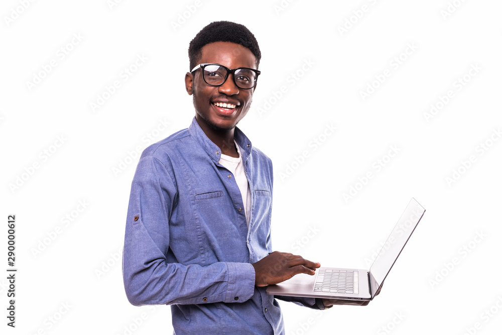 African American businessman using a laptop and posing isolated over white background