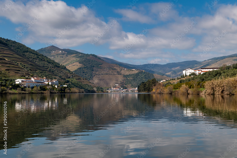 Scenic view of the Pinhao village with terraced vineyards and the Douro River and the Douro Valley, in Portugal; Concept for travel in Portugal and most beautiful places in Portugal Scenic view of the Pinhao village with terraced vineyards and the Douro River and the Douro Valley, in Portugal; Concept for travel in Portugal and most beautiful places in Portugal