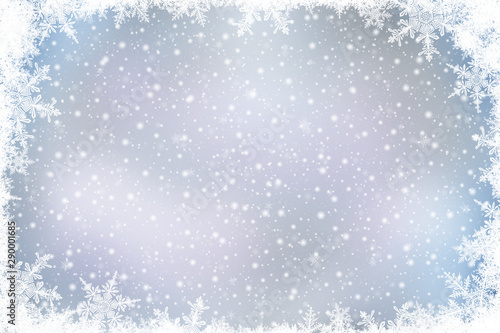 Decorative Christmas background with bokeh lights and snowflakes.