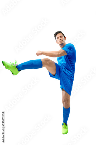 Asian football player man in the pose of kicking the ball
