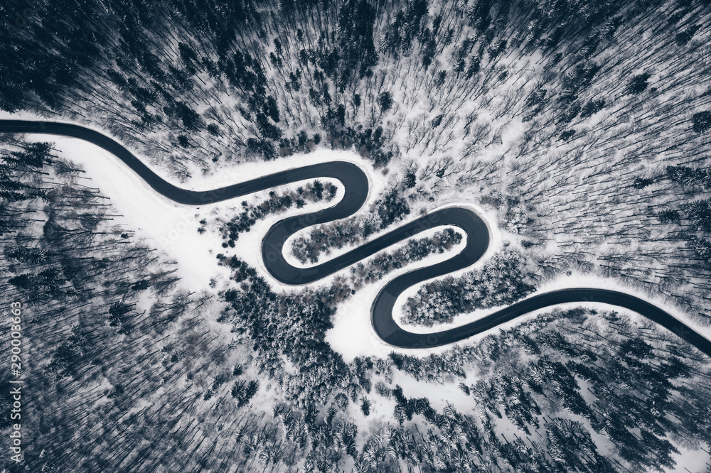 Aerial view of a winter road in the forest