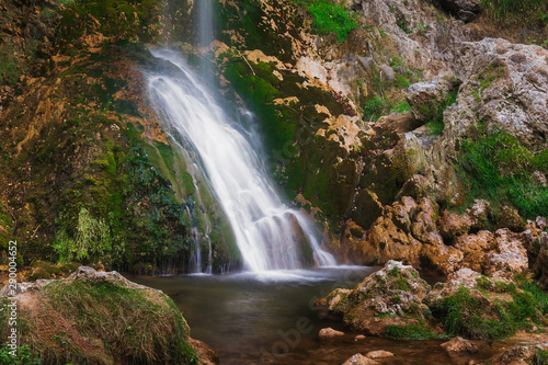 Beautiful waterfall in the village of Gostilje, close up. Nature outdoors travel destination Gostilje, Zlatibor mountain, Serbia 
