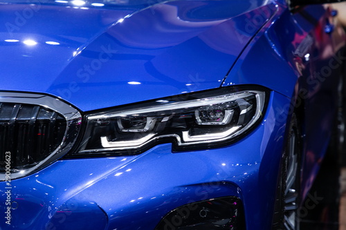 blue car front headlight new design in motor show . © Rattanachai