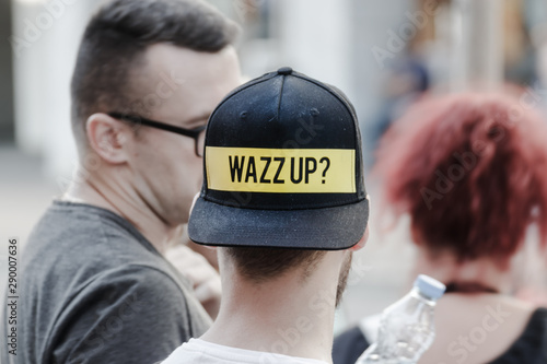 Wazz up sign on the  hat  