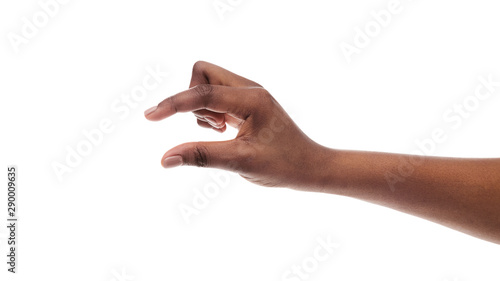 Valokuva Black hand showing small amount of something on white background