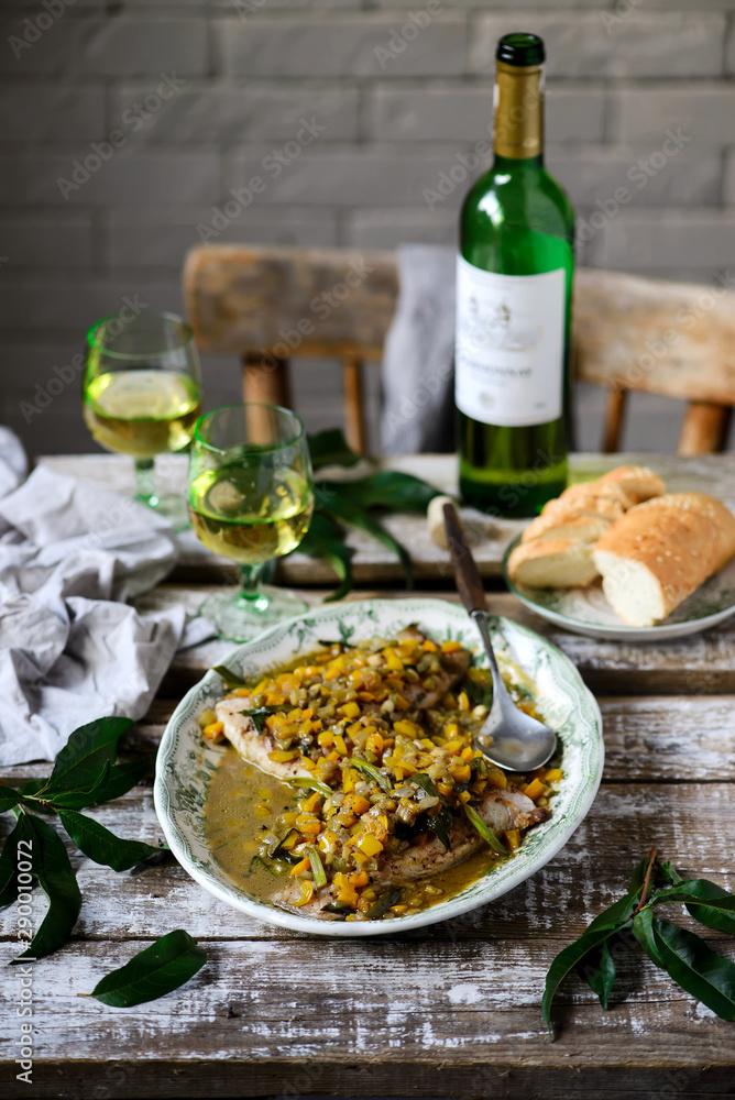 Fish under a vegetable marinade with wine. Fish under a vegetable marinade with wine.