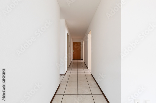 White empty corridor with tile