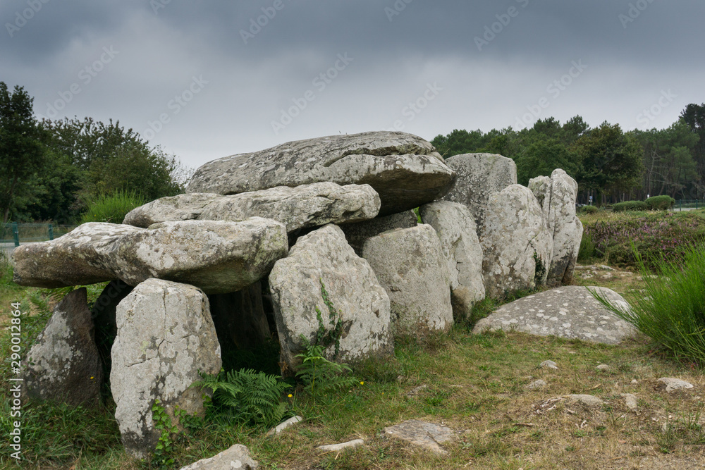 stone tomb or dolmen at the standing stone alignments of Carnac in Brittany stone tomb or dolmen at the standing stone alignments of Carnac in Brittany