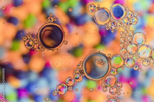 Close up crystalline bubbles with hued background photo