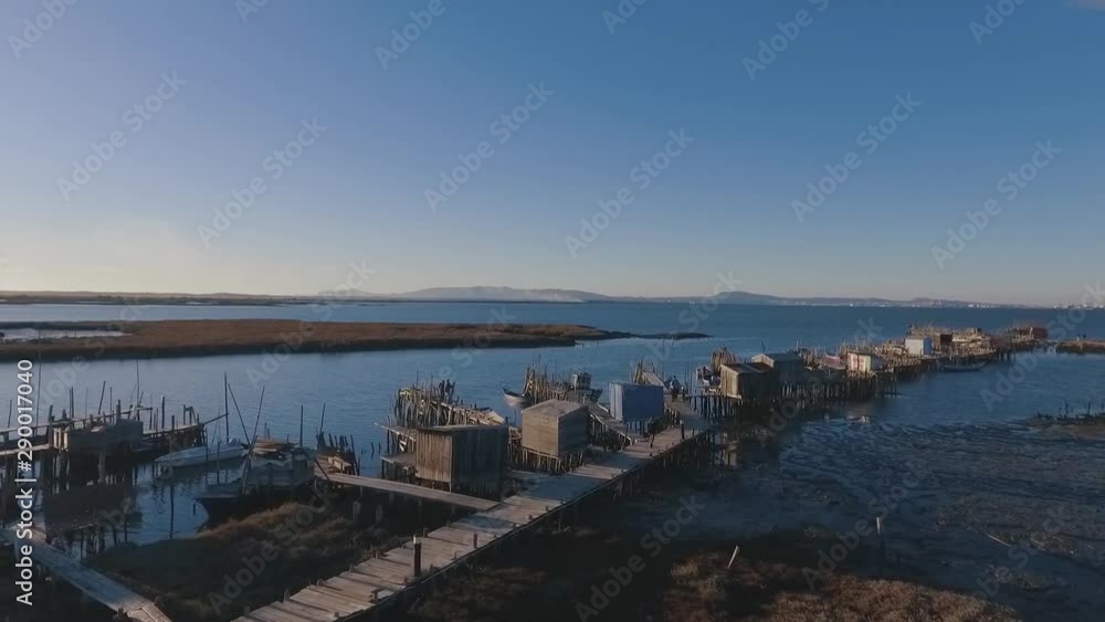 Flying over a traditional fishermen's quay with absolute photogenic views over the Sado Estuary Natural Reserve, in Portugal