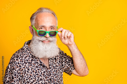 Close up photo of old man pensioner having been retired and sent to have rest abroad enjoying life while isolated with yellow background
