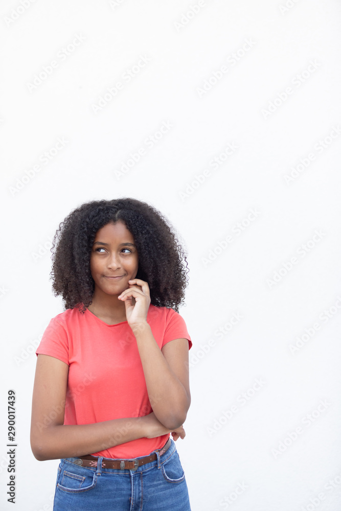 Pensive teenager girl with a beautiful afro hair Pensive teenager girl with a beautiful afro hair