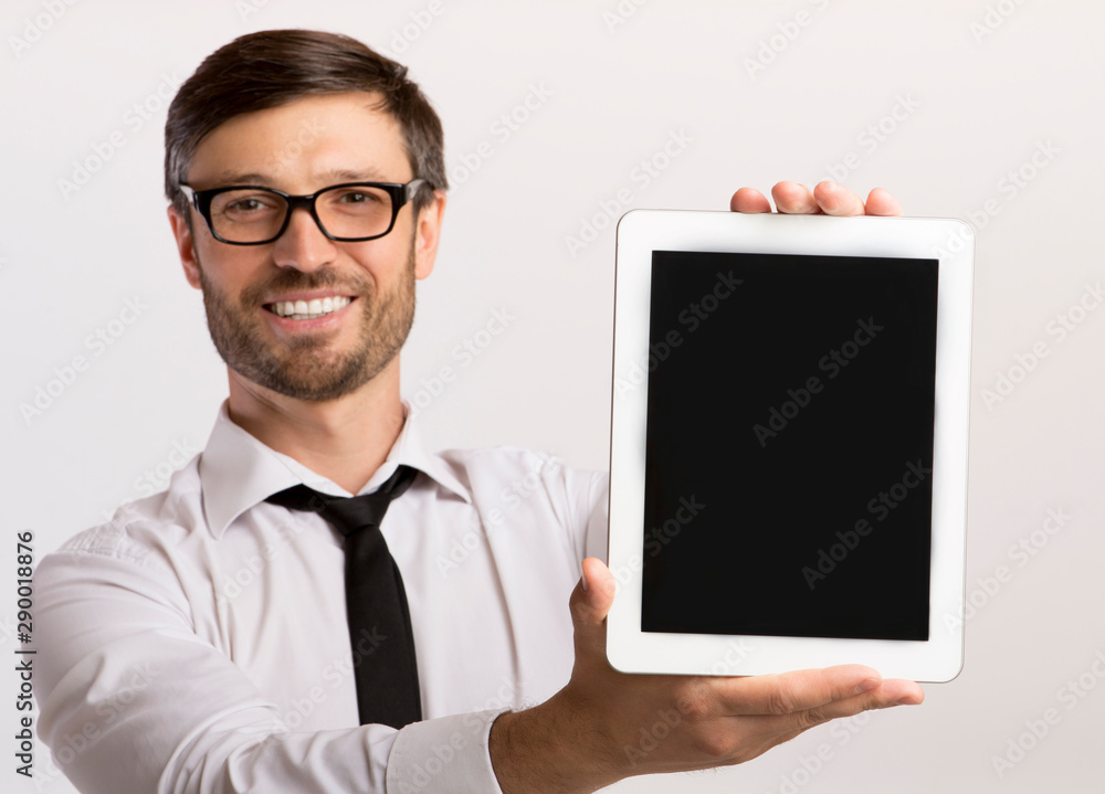 Smiling Business Man Showing Empty Tablet Screen On White Background Smiling Business Man Showing Empty Tablet Screen On White Background