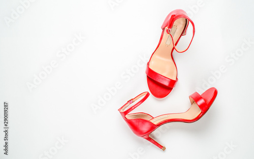 Summer Sandals on white background top view, flat lay, fashion, minimalism concept. Top view.