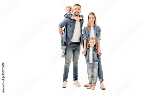 full length view of happy family in jeans smiling isolated on white