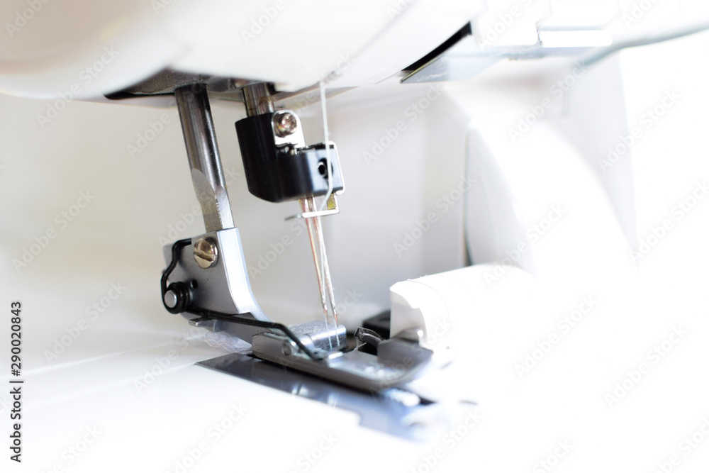 Overlock sewing machine close-up.
