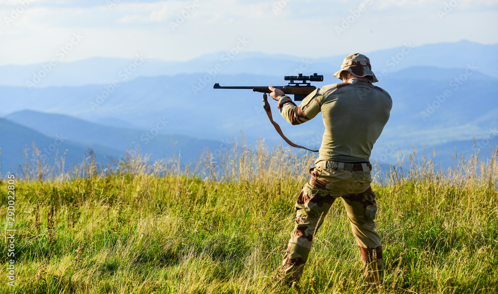Nice shot. Army forces. Hunter hold rifle. Hunter mountains landscape background. Focus and concentration experienced hunter. Man military clothes with weapon. Brutal warrior. Rifle for hunting Nice shot. Army forces. Hunter hold rifle. Hunter mountains landscape background. Focus and concentration experienced hunter. Man military clothes with weapon. Brutal warrior. Rifle for hunting