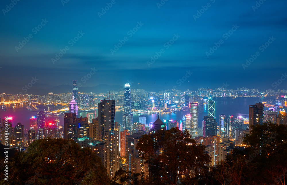Night city landscape. View from Victoria Peak to Victoria Harbor at night in Hong Kong.