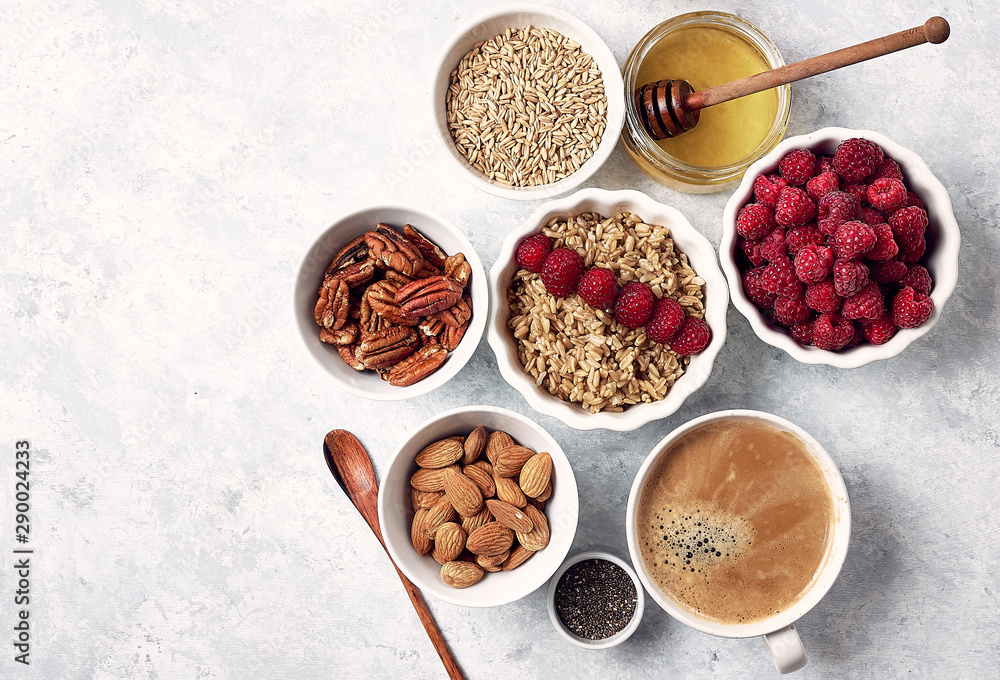 healthy oatmeal breakfast with raspberries and finns, chia and flax seeds and honey, pattern, top visas, good morning concept healthy oatmeal breakfast with raspberries and finns, chia and flax seeds and honey, pattern, top visas, good morning concept