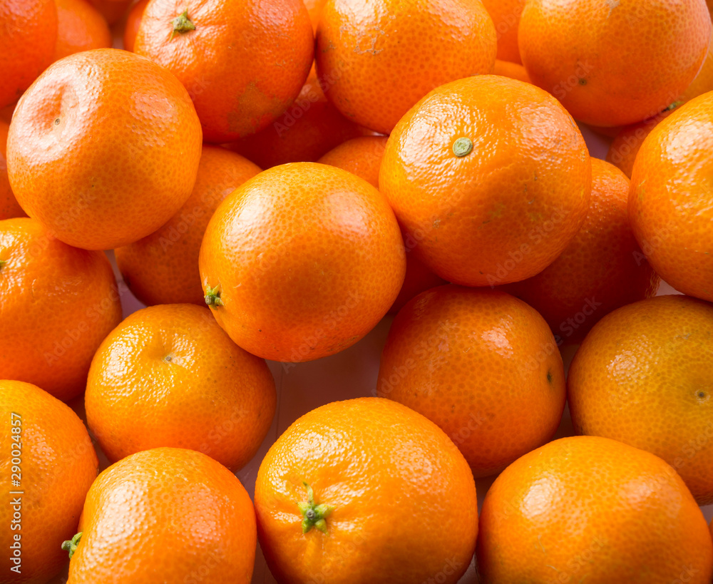 Top view. Fresh tangerines. Ripe and tasty mandarins. Clementines. Background tangerines. Top view. Fresh tangerines. Ripe and tasty mandarins. Clementines. Background tangerines.