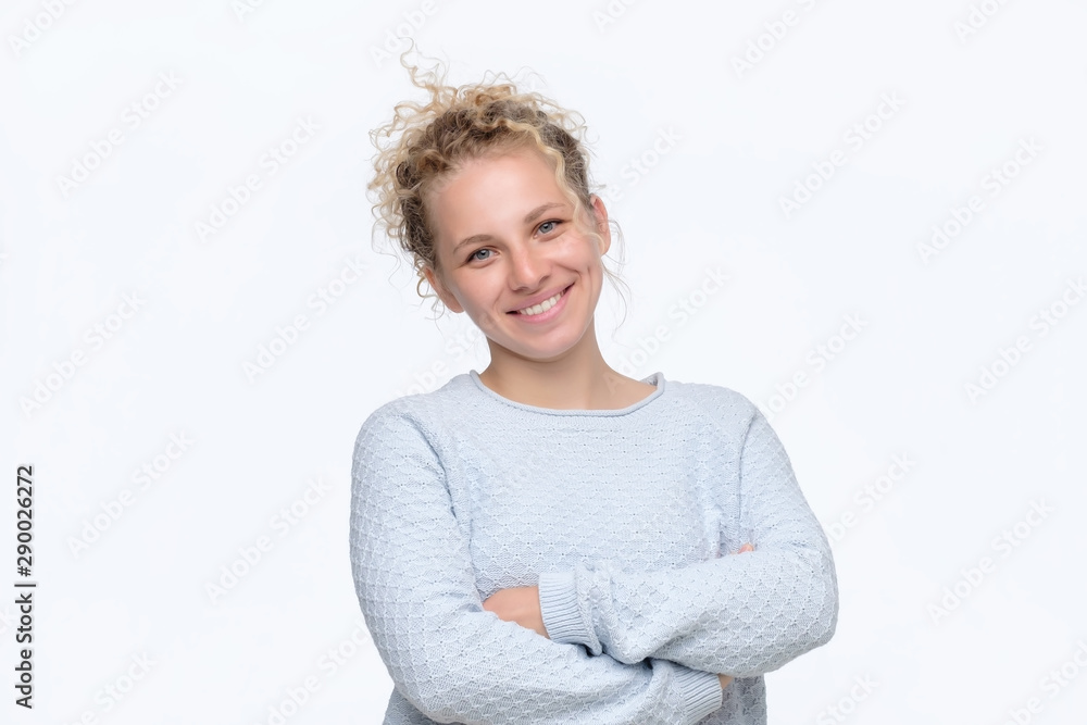 Happy smiling woman portrait with crossed arms being excited. Studio shot Happy smiling woman portrait with crossed arms being excited. Studio shot