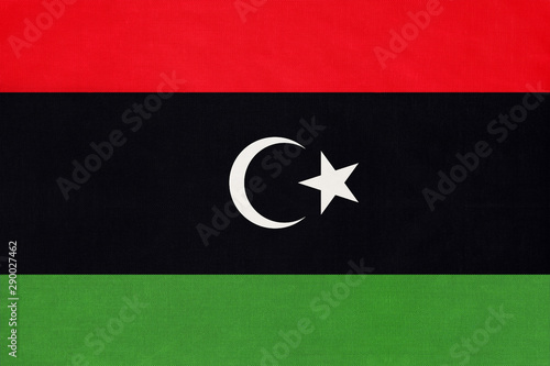 Libya national fabric flag textile background. Symbol of international world African country. photo