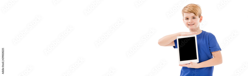 panoramic shot of smiling boy in blue t-shirt holding digital tablet with blank screen isolated on white panoramic shot of smiling boy in blue t-shirt holding digital tablet with blank screen isolated on white