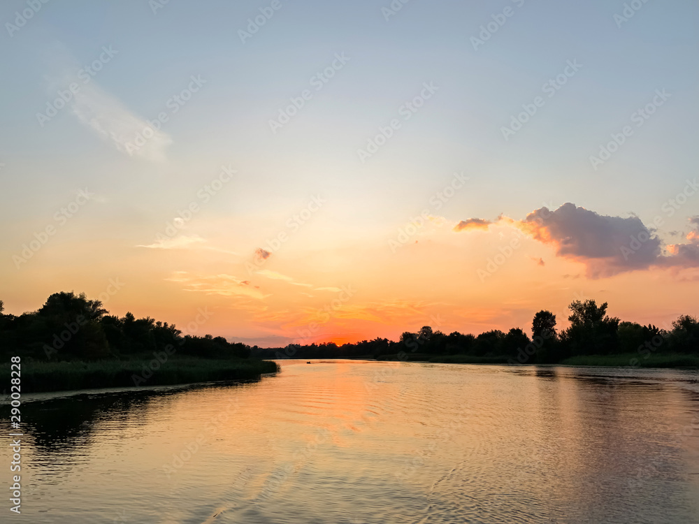 Beautiful summer sunset on the Dnipro river. Kherson, Ukraine. Landscape Beautiful summer sunset on the Dnipro river. Kherson, Ukraine. Landscape