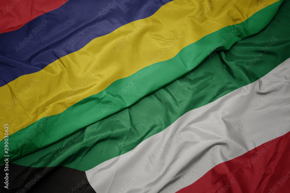 Obraz premium waving colorful flag of kuwait and national flag of mauritius.