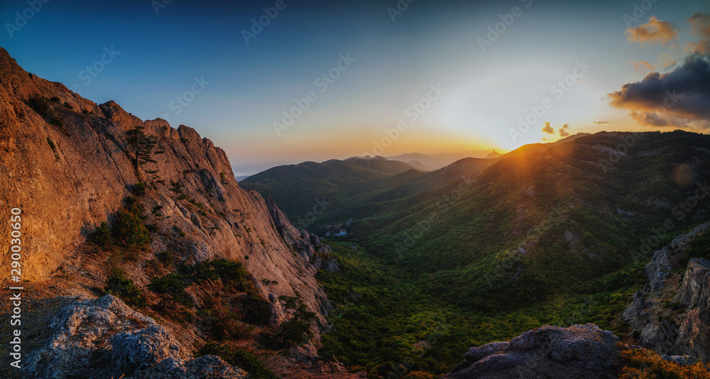 Beautiful golden sunset in the mountains panorama