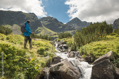 Sporty hiker near summer spring in Tatra Mountains national park, Zakopane, Poland