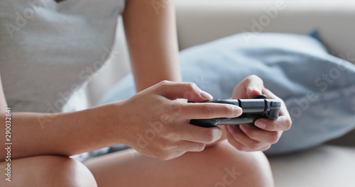 Woman play tv game at home