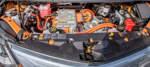 under the hood of an orange electric car, technology of the future © Danieduverger