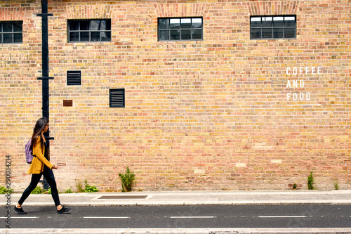 Photography Young girl following Coffee and Food direction with bricks background