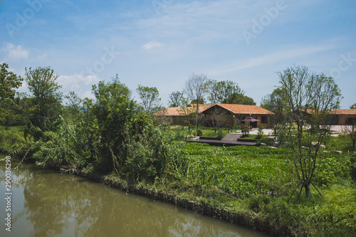 House by river at Archaeological Ruins of Liangzhu City