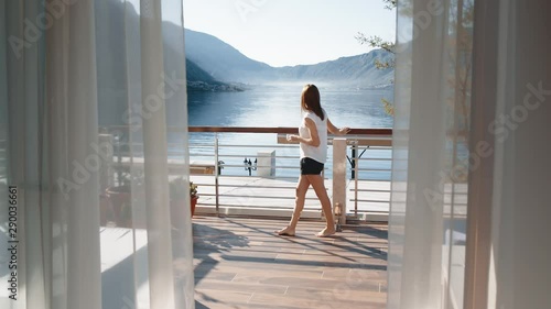 woman enjoying the scenery in luxury apartment