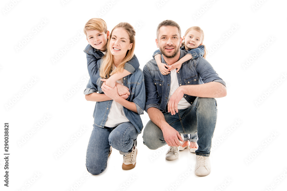 happy family in jeans embracing and smiling isolated on white happy family in jeans embracing and smiling isolated on white