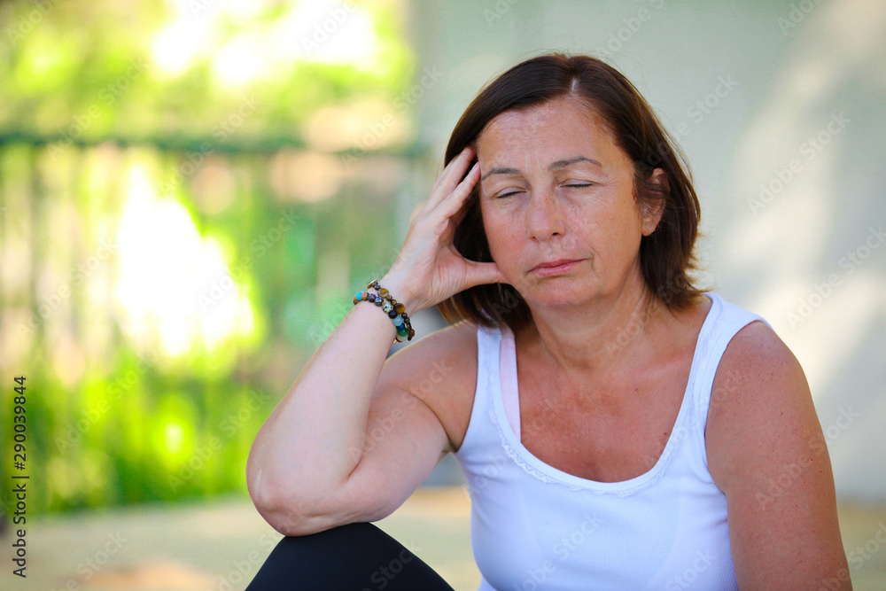 Pretty mid age woman is thinking in the nature. Pretty mid age woman is thinking in the nature.